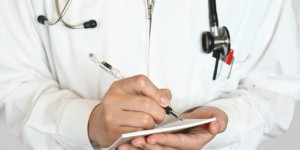 a doctor is writing an excuse note